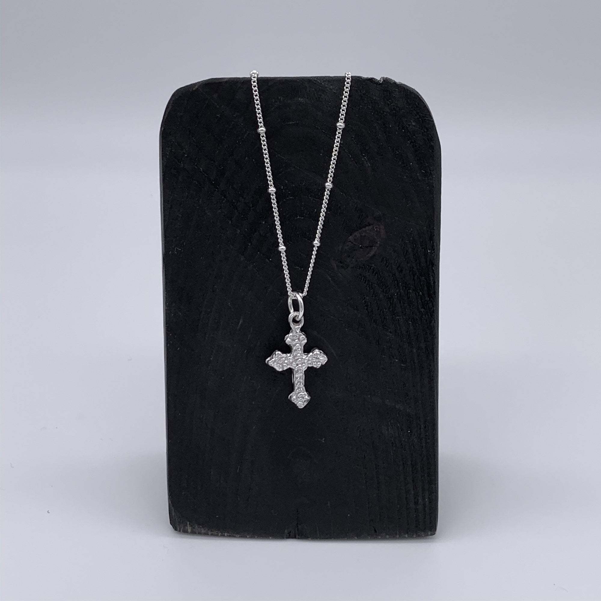 Ornate Ruffled Cross Necklace